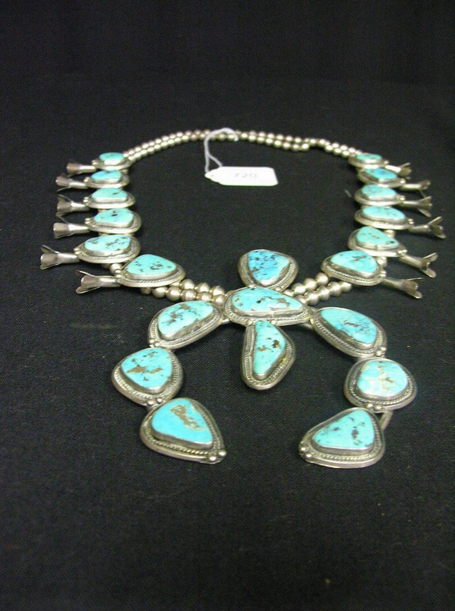 Appraisal: SILVER TURQUOISE SQUACH BLOSSOM Large Naja with large turquoise stones