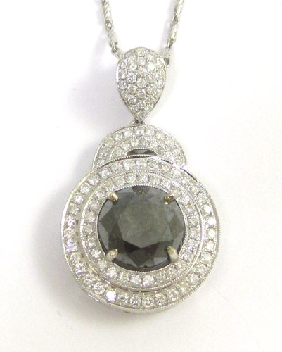 Appraisal: BLACK DIAMOND PENDANT NECKLACE suspended on an inch white gold