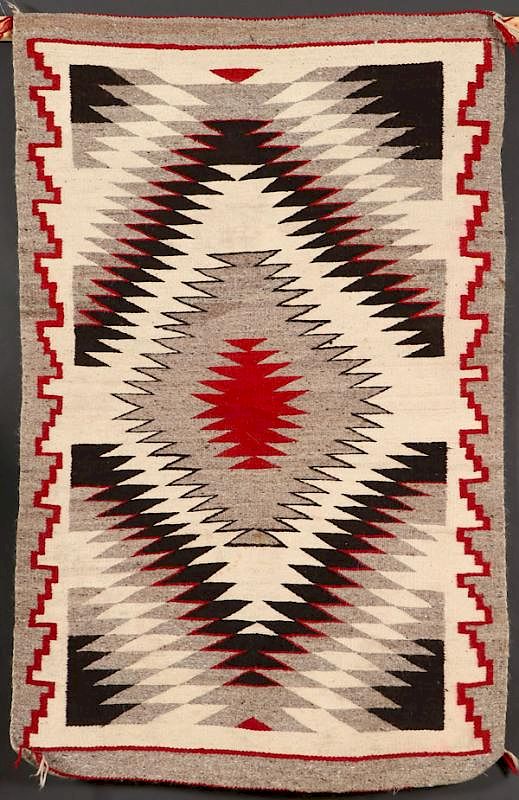 Appraisal: A SOUTHWEST NAVAJO EYE DAZZLER HANDWOVEN RUG A SOUTHWEST NAVAJO