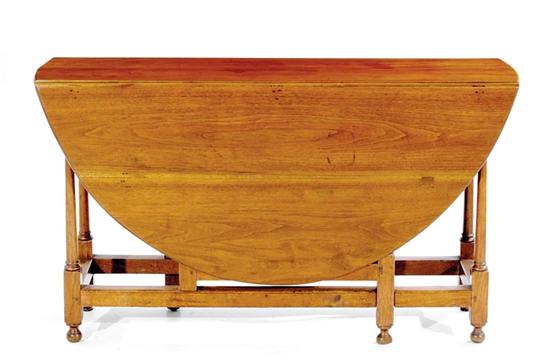 Appraisal: American walnut gateleg table th century oval top with drop