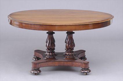 Appraisal: EARLY VICTORIAN CARVED MAHOGANY EXTENSION DINING TABLE The circular divided