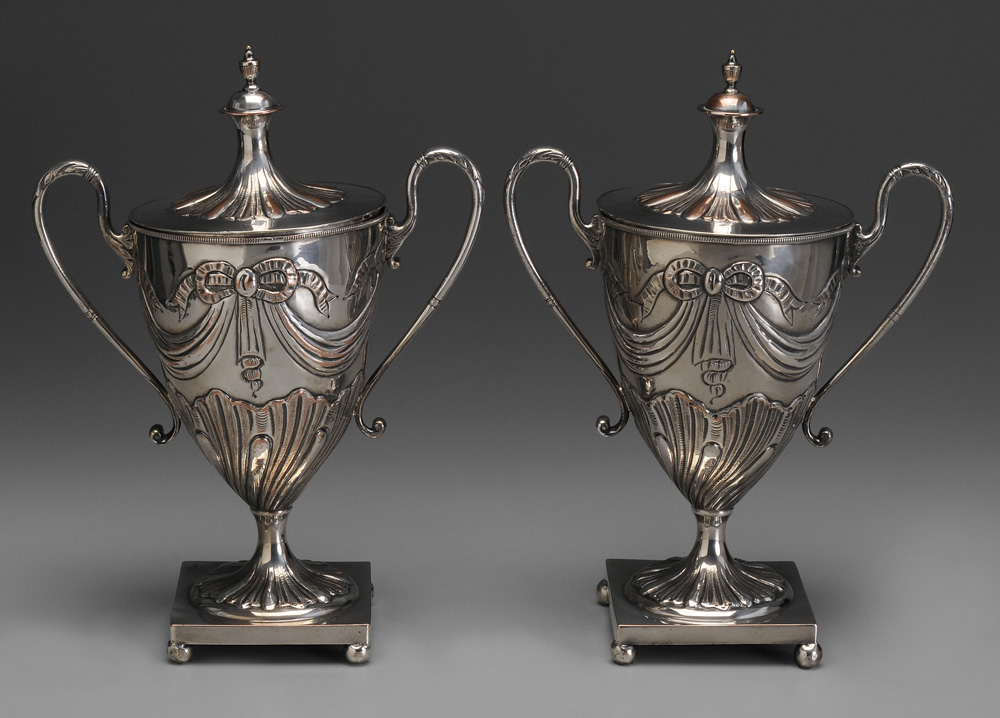 Appraisal: Pair Silver-Plated Covered Urns English th century ribbon and swag