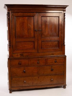 Appraisal: A George III oak and yew wood press cupboard the