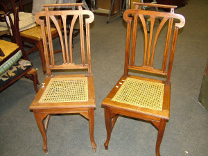 Appraisal: Four mahogany side chairs the shaped pierced splat back above