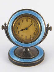 Appraisal: A silver boudoir clock the circular dial framed in blue