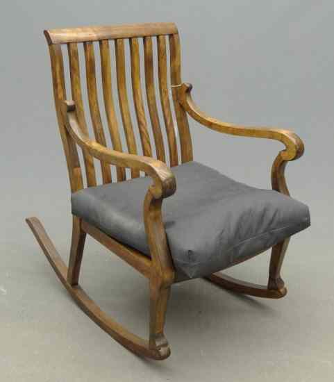 Appraisal: C 's curved slat rocking chair '' Seat Ht ''