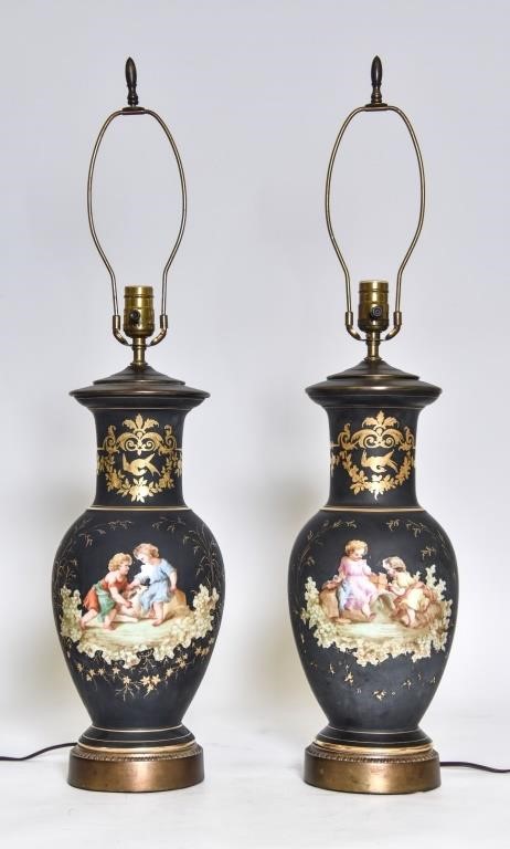 Appraisal: Large pair of French black porcelain lamps decorated with colorful