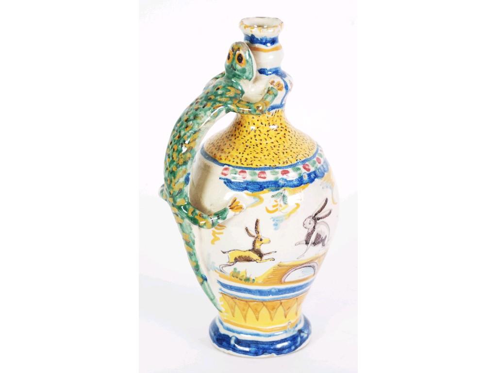 Appraisal: CONTINENTAL FAYENCE JUG with lizard handle polychrome decorated with a