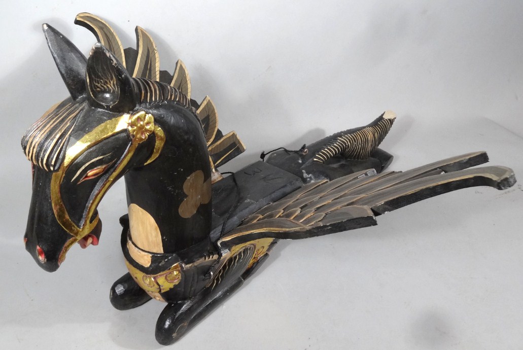 Appraisal: A modern carving of a winged horse in black with