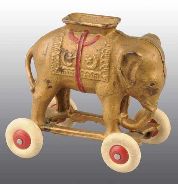 Appraisal: Cast Iron Elephant on Rubber Wheels Still Bank Description Manufactured