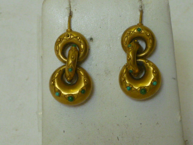 Appraisal: A PAIR OF VICTORIAN GOLD EARRINGS each having three interlocking