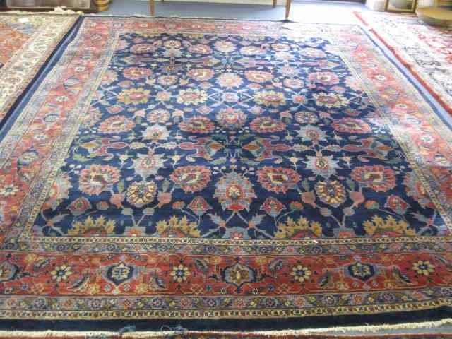 Appraisal: Sarouk Style Persian Handmade Room Sizerug florals on deep blue