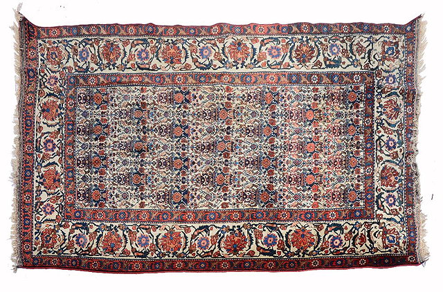 Appraisal: A PERSIAN ABADEH WHITE GROUND RUG with an intricate central