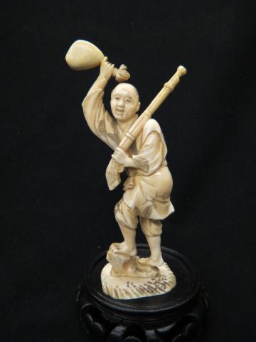 Appraisal: Oriental Carved Ivory Figurine of a Hunter holding rifle and