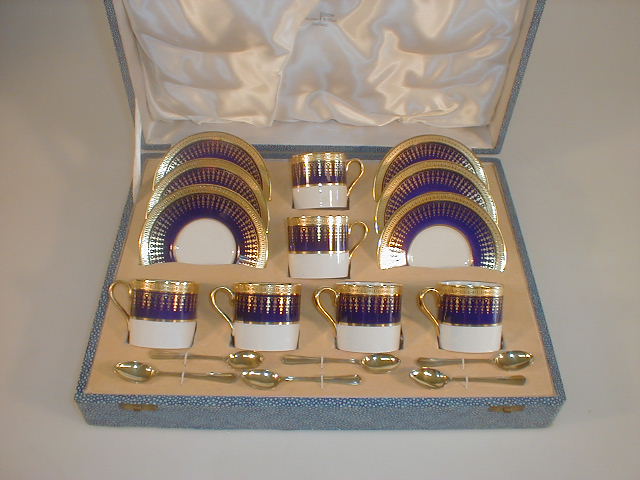 Appraisal: A Walker and Hall cased Aynsley bone china coffee set