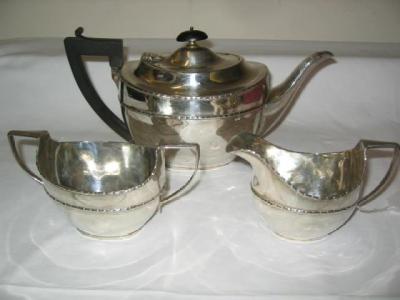 Appraisal: A THREE PIECE TEA SET of dished oval form with