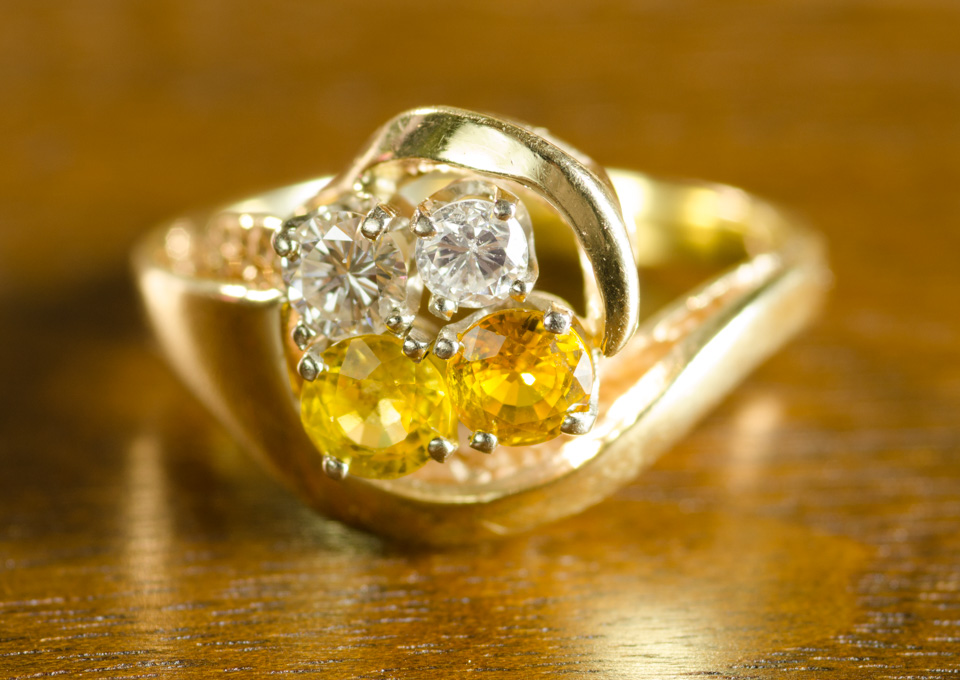 Appraisal: YELLOW SAPPHIRE AND DIAMOND RING The k yellow gold ring