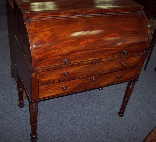 Appraisal: A George IV mahogany cylinder bureau with plain rectangular top