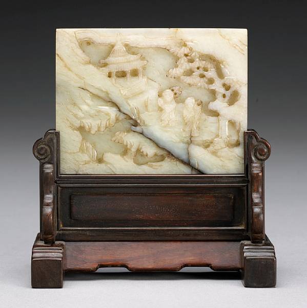 Appraisal: A carved rectangular jade plaque Carved in high relief on