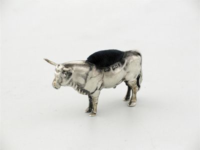 Appraisal: A bull pin cushion with long horns by Levi Salaman