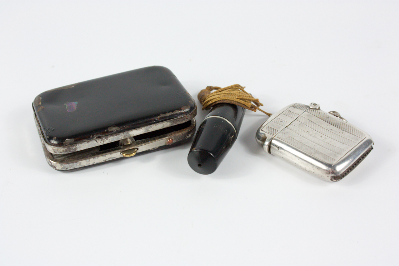 Appraisal: An Air France folding cigarette holder in case and two