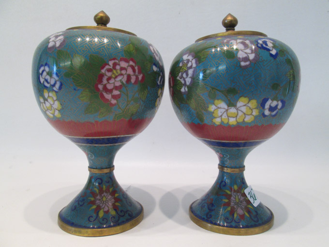 Appraisal: PAIR CHINESE CLOISONNE LIDDED URNS with colorful floral and foliate