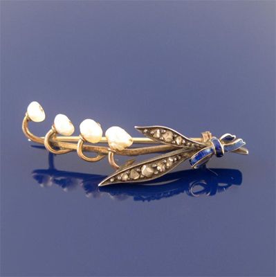 Appraisal: A pearl and diamond brooch in the form of lily