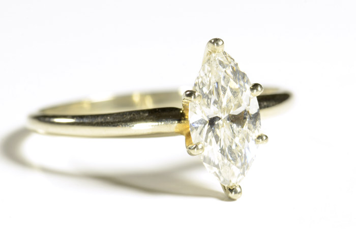 Appraisal: DIAMOND AND FOURTEEN KARAT GOLD SOLITAIRE RING WITH APPRAISAL the