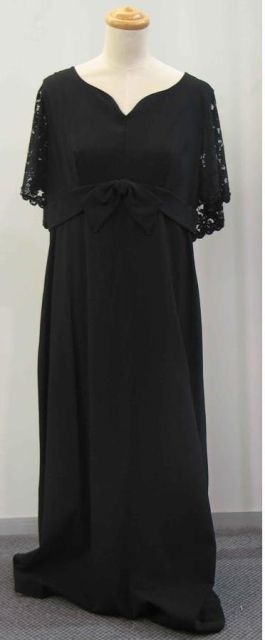 Appraisal: Evening dress in black rayon crepe with lace cape sleeves