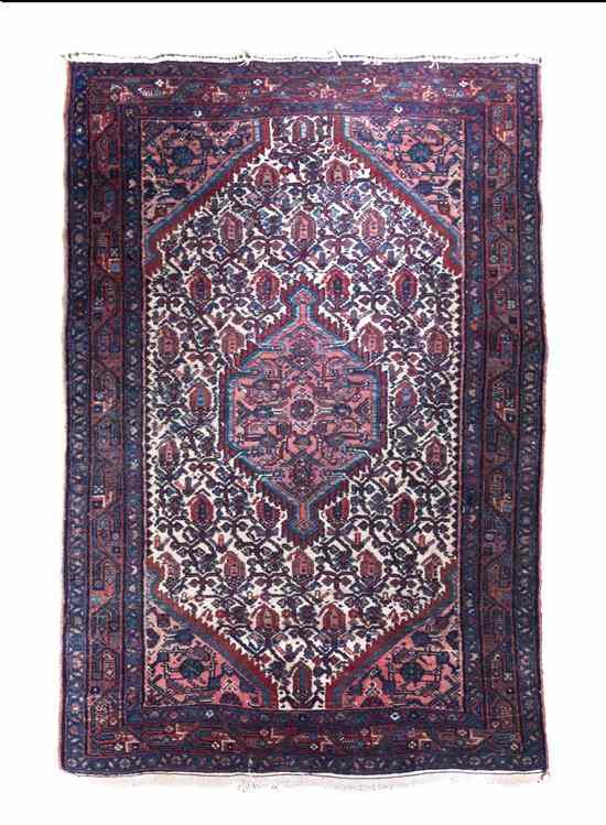 Appraisal: A Tabriz Wool Rug having a stylized hexagonal center medallion