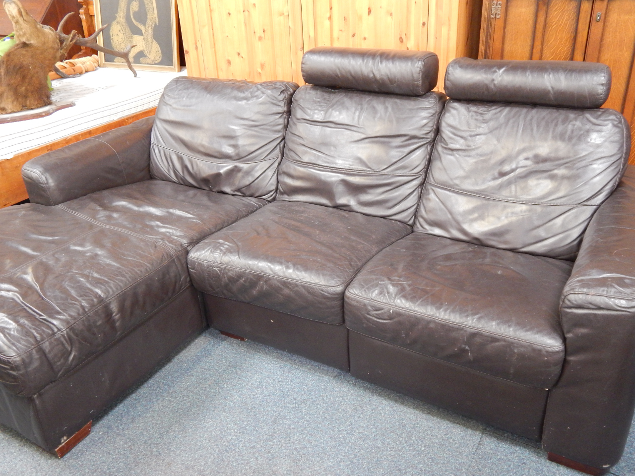 Appraisal: A brown leather three seater corner sofa two part cm