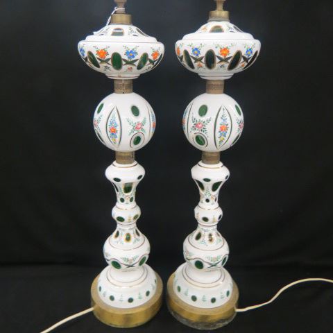 Appraisal: Pair of Emerald White Overlaid Glass Lamps cut back design