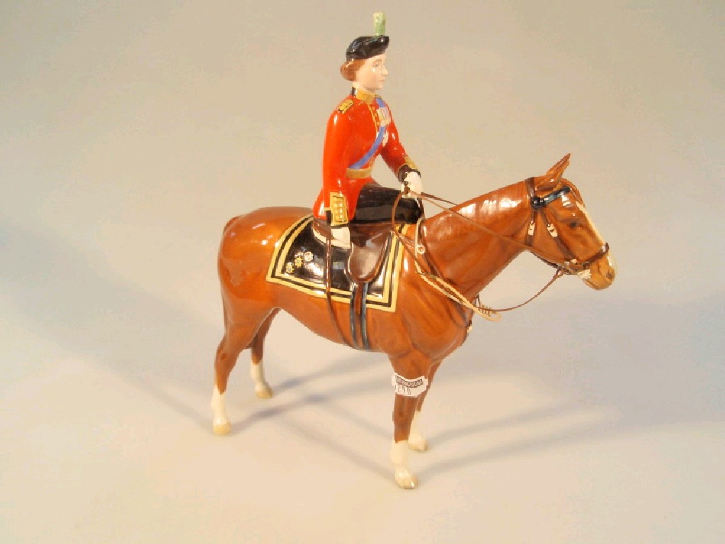 Appraisal: A Beswick figure of HM Queen Elizabeth II mounted on