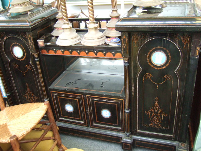 Appraisal: A late Victorian ebonised and inlaid side cabinet with brass