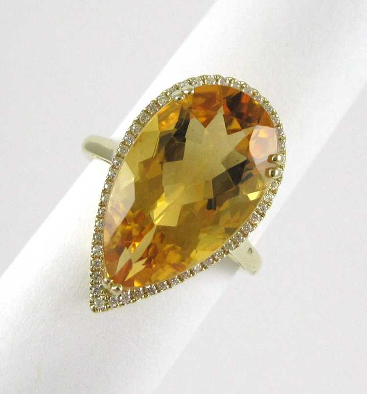 Appraisal: CITRINE AND FOURTEEN KARAT YELLOW GOLD RING the pear cut