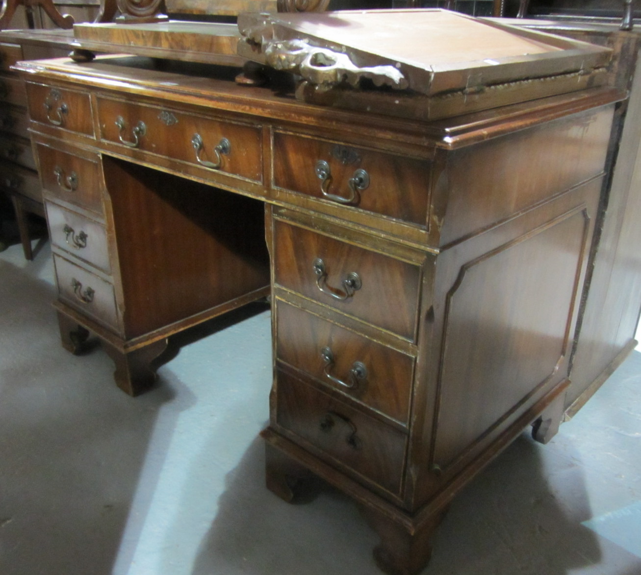 Appraisal: A th century mahogany pedestal desk with gilt tooled leather