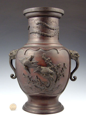 Appraisal: BRONZE ORIENTAL VASE Raised images of birds on branches flying