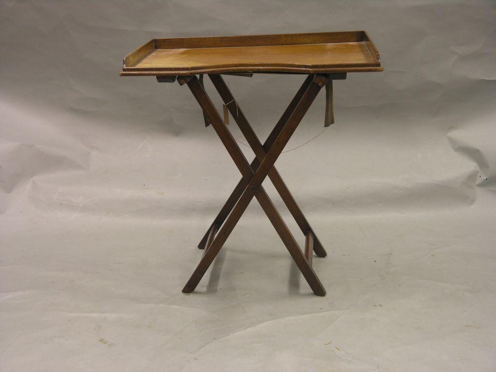 Appraisal: A th century mahogany butler's tray on folding stand ft