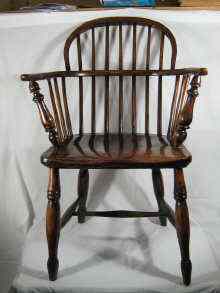 Appraisal: A Windsor ash comb back chair with elm seat