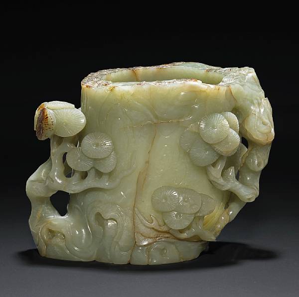 Appraisal: A pale green jade brush pot Thickly walled and deeply