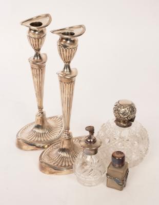 Appraisal: A pair of silver candlesticks Sheffield of oval form with