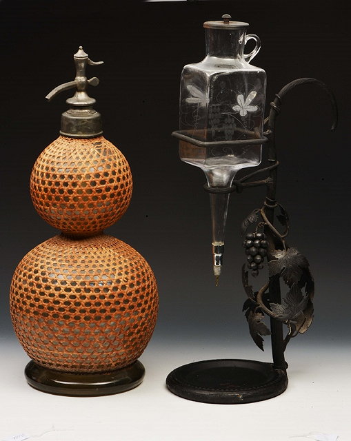 Appraisal: A METAL WINE DISPENSER of grapevine form with engraved glass