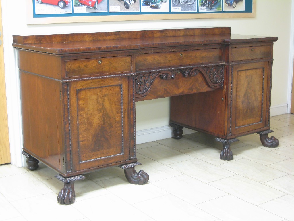 Appraisal: An early th Century mahogany Sideboard with raised back fitted