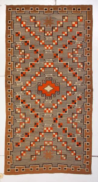 Appraisal: A Navajo pictorial rug With small centered diamond framed by