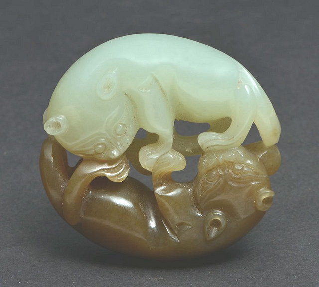 Appraisal: A CHINESE TWO COLOURED JADE CARVING OF TWO INTERTWINED CATS