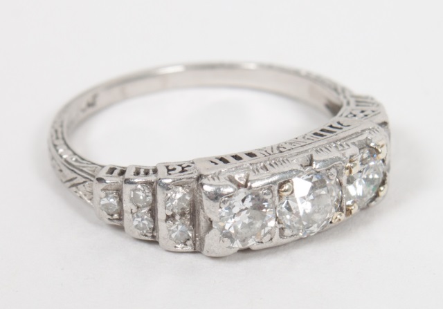 Appraisal: Lady's platinum and diamond filigree ring presenting three mine-cut stones