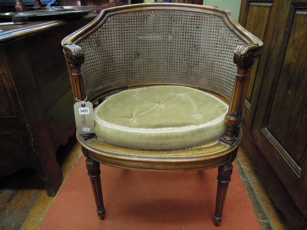 Appraisal: A th century continental walnut tub chair with shaped and