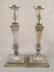 Appraisal: A pair of white metal tests silver candlesticks the ribbed