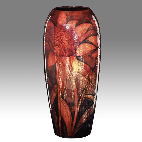 Appraisal: MOORCROFTTall and rare red flambe vase with blossoms Some underglaze