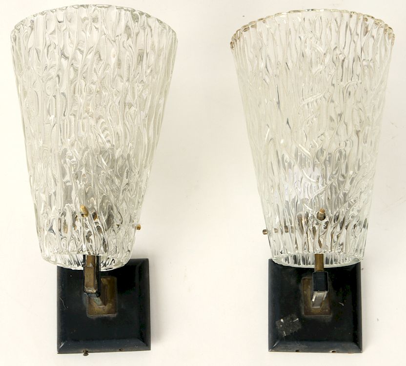 Appraisal: PAIR BRONZE SCONCES HEAVY GLASS SHADES C A pair of